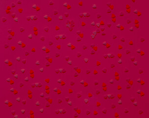 Pattern from hearts in shades of magenta. Color of the Year 2023. Festive Template of greeting card or packaging design. 