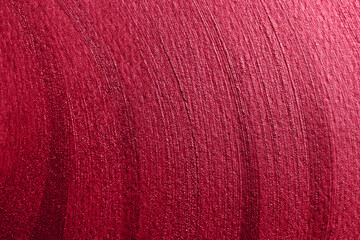 red shining stroke texture made with brush and paint hand drawn. Demonstrating Viva Magenta - trendy color of the year 2023