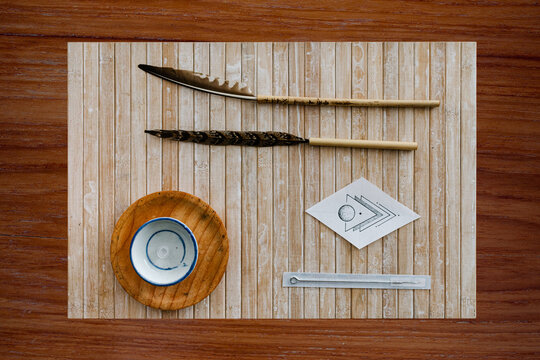 Handpoke natural technique, hand poke tattoo display items over table