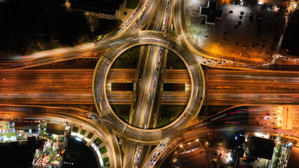 Aerial drone slow shutter night photo of illuminated urban elevated toll ring road junction and interchange overpass passing through Kifisias Avenue, Attica, Greece