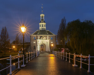 The old city gate Zijlpoort in Leiden at sunrise.