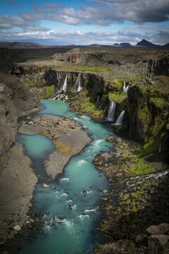 Fototapeta Vertical shot of the Sigoldugljufur canyon with the river and little springs in Iceland
