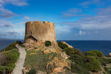 Fototapeta na wymiar Old Spanish turret, torre spagnola, torre longosardo tower, in Santa Teresa Gallura, Sardinia. Corsica on the background.