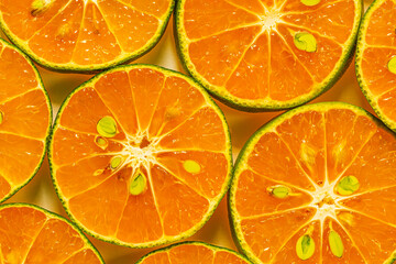 macro orange,Heap of fresh orange slices background. Healthy nutrition with vitamin c. Close up view.