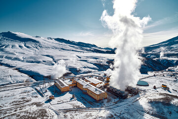 Aerial view to geothermal power plant in mountain. Clean green renewable energy in Kamchatka. - 550932241