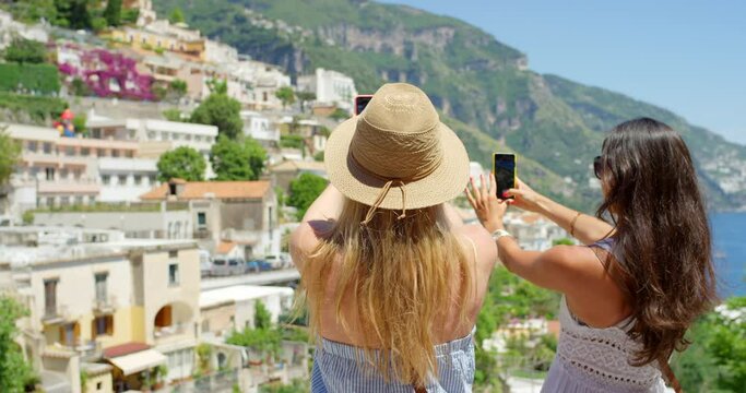 Women, bonding or phone photography in travel location, Italy summer holiday or vacation on social media app, vlog or live streaming. Happy smile, waving tourist or mobile picture technology of city