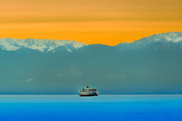 Ferry on the Sea at Sunset
