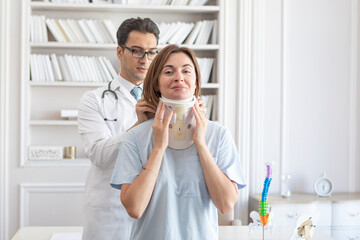 Male doctor orthopedist explaining to his female patient with serious neck injury in neck brace about importance of cervical collar for healthy cure