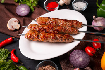 minced meat kebab on a white background