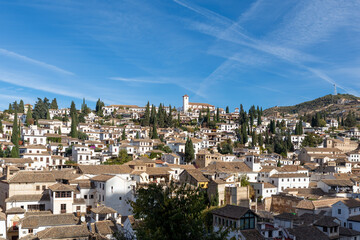 Obraz premium Granada's Albaicin neighborhood (World Heritage Site) seen from the viewpoint of La Churra, on the Alhambra hill, a sunny winter morning