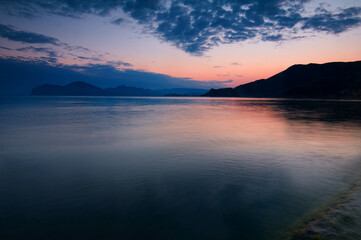 Dusk and dawn landscape. Beautiful Crimean sea bay at evening time.