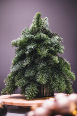 Small portable tabletop easy DIY decorated Christmass tree. Defocused