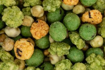 snack mix with rice crackers, nuts and peas with wasabi flavor