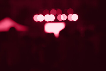 viva magenta trendy color light bokeh. Dark pink background with space for text. Color of the year abstract backdrop.