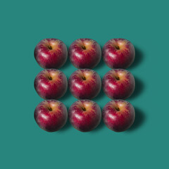 Fall pattern in red and dark green. Minimal frame background with ripe red apples with soft shadow. - 550940679
