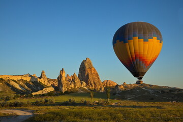 Landing of a hot-air balloon at Cavusin,Cappadocia,Nevsehir Province,Turkey
