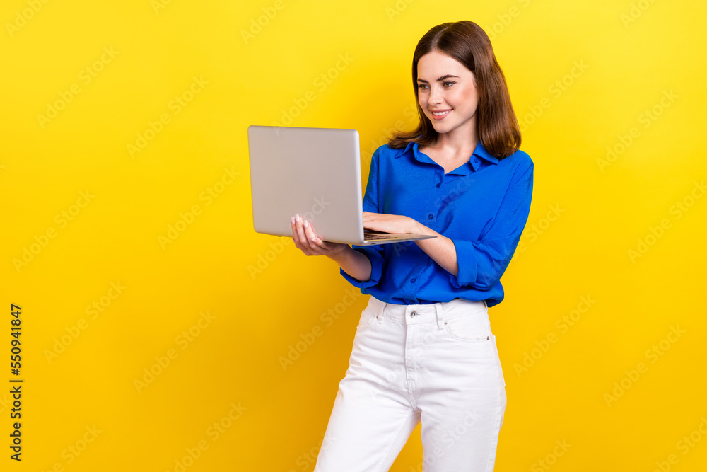 Sticker Photo of concentrated focused adorable ukrainian lady use netbook macbook stand empty space isolated on yellow color background