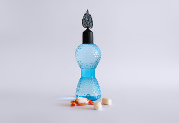 Cologne bottle and candy isolated. Happy Ramadan, happy kurban.(Turkish translate: Bayraminiz kutlu olsun. Kolonya şişesi ve şeker. Ramazan bayrami ve kurban bayrami.)