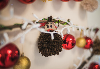 Colored Christmas spheres, with different shapes, one is in the shape of a sphere with a small reindeer.