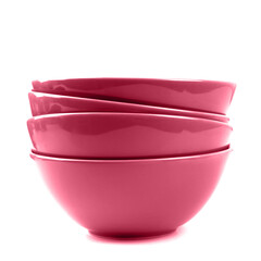 Stack of magenta bowls isolated on white.