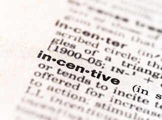 Fototapeta premium closeup of the word incentive dictionary definition 