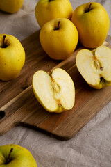 Naklejka na ściany i meble Raw Organic Golden Apples Ready to Eat, low angle view.