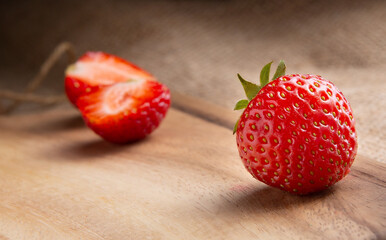 beautiful ripe red strawberry on a wooden plank. selective focus .High quality photo