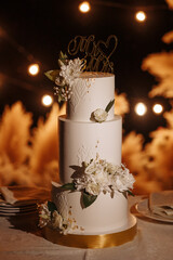 Wedding dessert under the light of evening light bulbs