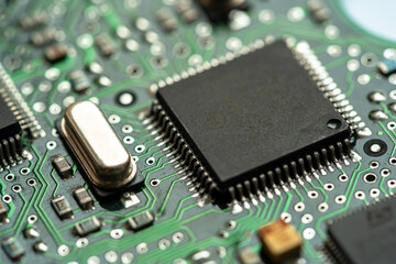 Small microprocessor, microcontroller chip on a generic modern desktop PC computer motherboard,...