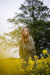 Girl in a yellow field in summer