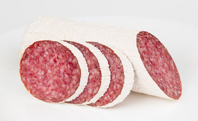 Salami slices on a white background, Italian sausage.