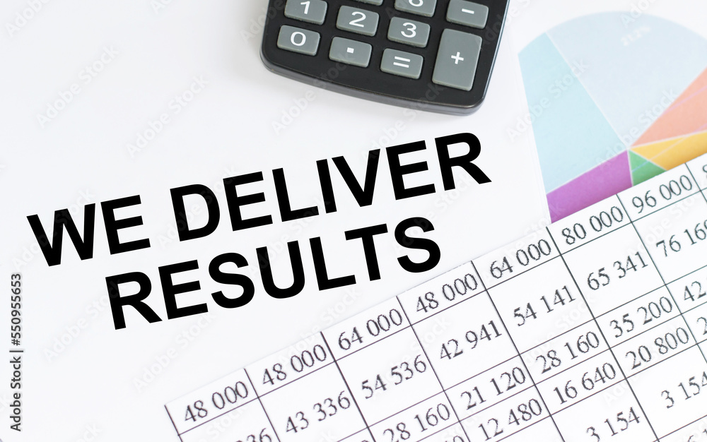 Poster we deliver results text on notepad on a table with documents with a calculator on the table