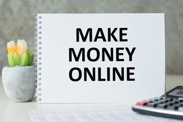 MAKE MONEY ONLINE text on a notepad on the table, business concept