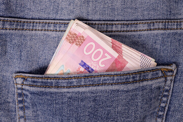 Ukrainian money Uah hrn gryvna hryvnia in pocket. The concept of savings, investment