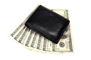 Black leather wallet on a fan of dollars isolated on a white background
