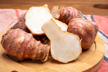 Group of fresh uncooked topinambur or Jerusalem artichoke roots