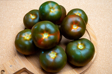 Fresh ripe sweet reddish brown and green kumato tomatoes