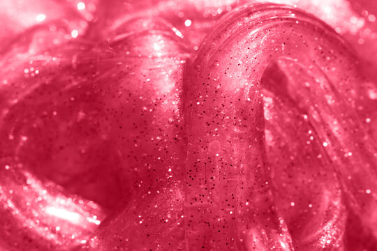 Red monochrome slime texture with glitter.Good for text overlay.