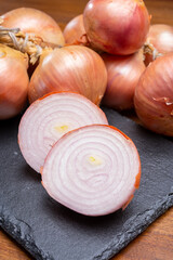 Bunch of french AOP pink onions from Roscoff village in Brittany, France