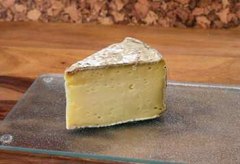 Pieces of cheese tomme de montagne or tomme de savoie made from cow milk in French Alps