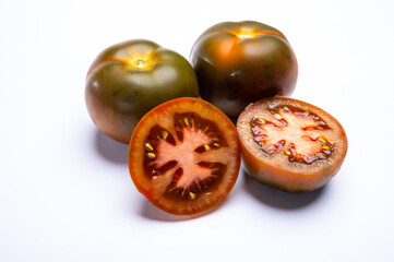 Fresh ripe sweet reddish brown and green kumato tomatoes