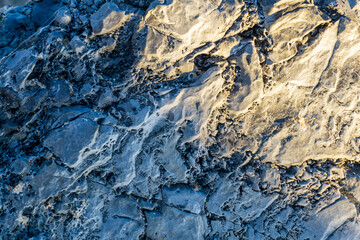 Coastal rocks in the rays of setting sun