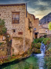 Fototapeta na wymiar Orbaneja del Castillo village, famous village for its cascades Burgos province, Spain