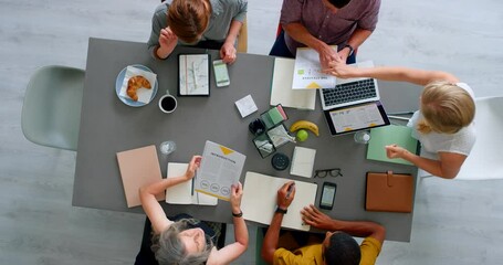 Business meeting, team and digital marketing collaboration top view, planning stratergy and working together with snacks at desk. Teamwork, brainstorming and group of business people consulting