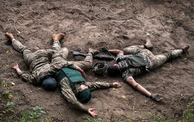 Wounded soldiers lie on the battlefield