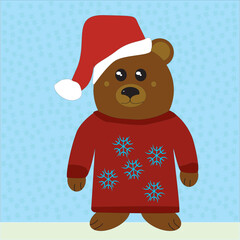 A little bear in a sweater with snowflakes and a Santa hat