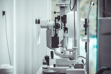 Different devices for measuring diopter and eye examination. Visit at the ophtalmologist, eye doctor, with all devices and appliances. Laser surgery.