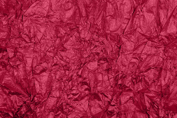 Trendy viva magenta color of the year 2023 background with uneven surface.