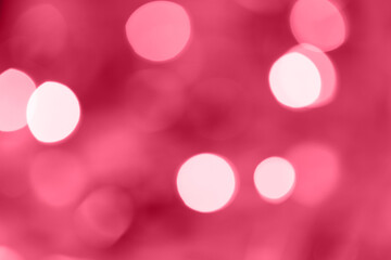Festive abstract blurred bokeh background magenta color.