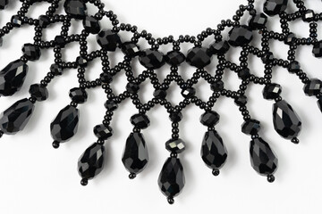 handmade colorful bead necklace close-up isolated on white background.